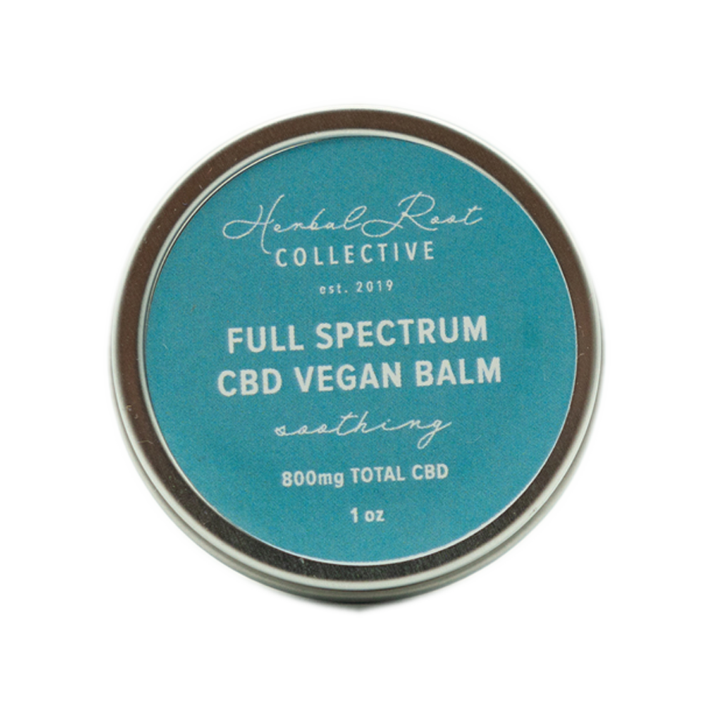silver lip balm container with blue label by herbal root collective 3
